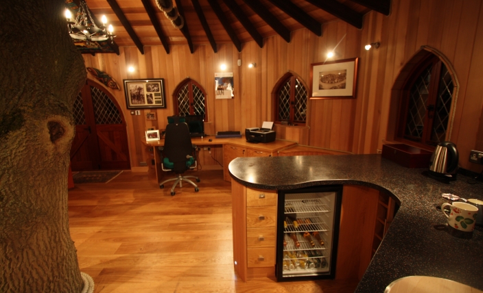 The Treehouse Office, built and designed by Blue Forest, has a kitchenette with a wine cooler. 