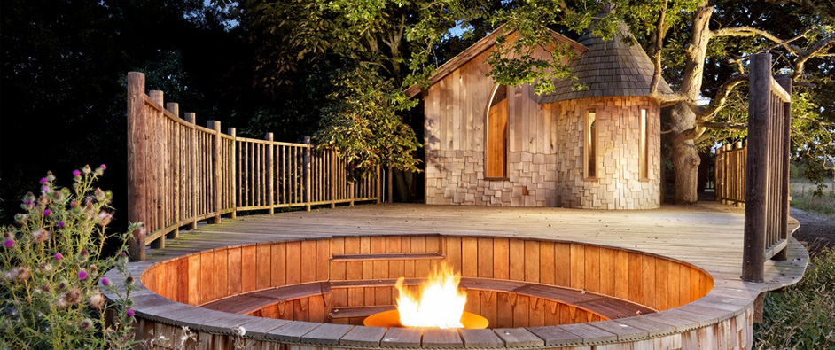 The Nook Treehouse features a private space enclosed by handrails leading from the treehouse to the  outside seating area. The sunken firepit is great for long evenings outside and when the fire has died down, a bit of stargazing.